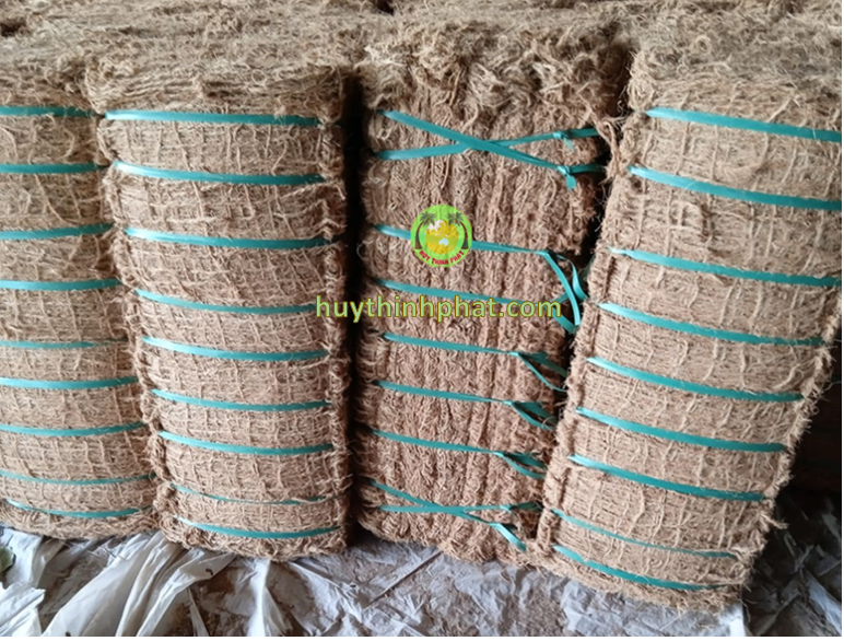 Coconut fiber mesh pressed into packages